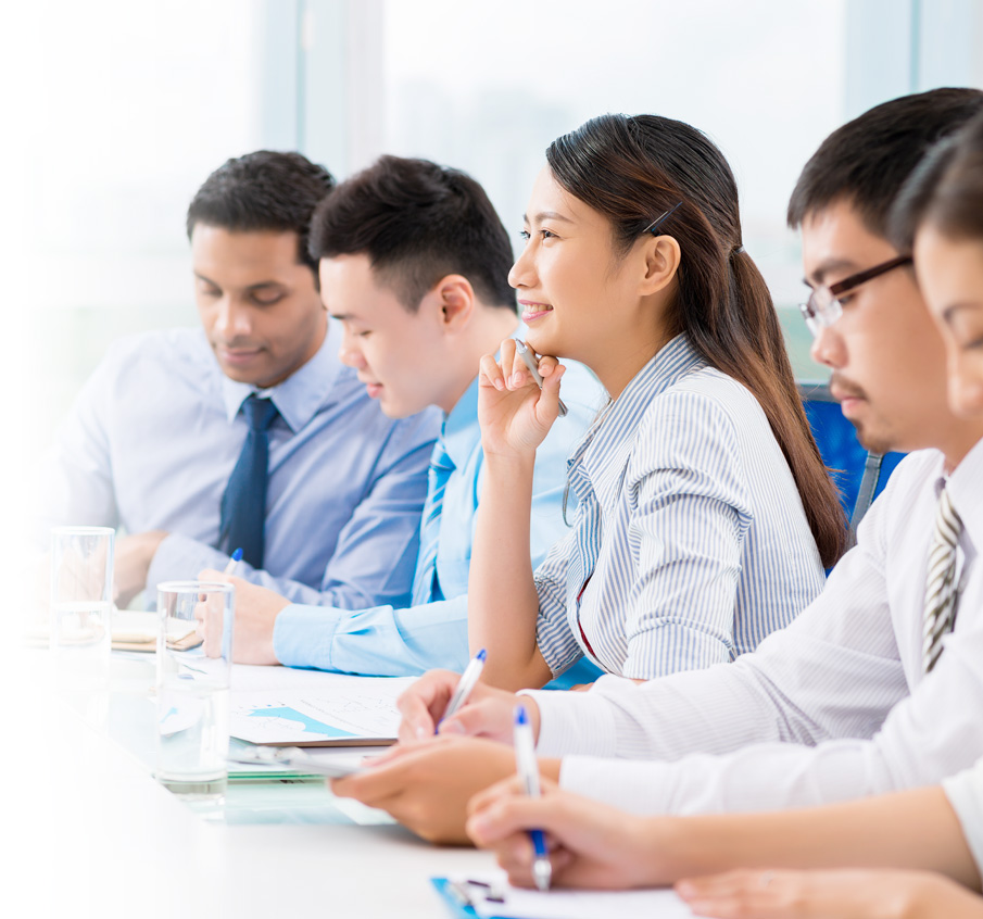 office workers listening and taking notes